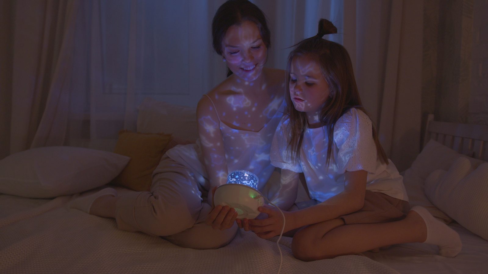 Cozy bedroom set up for the galaxy projector aesthetic with soft ambient lighting