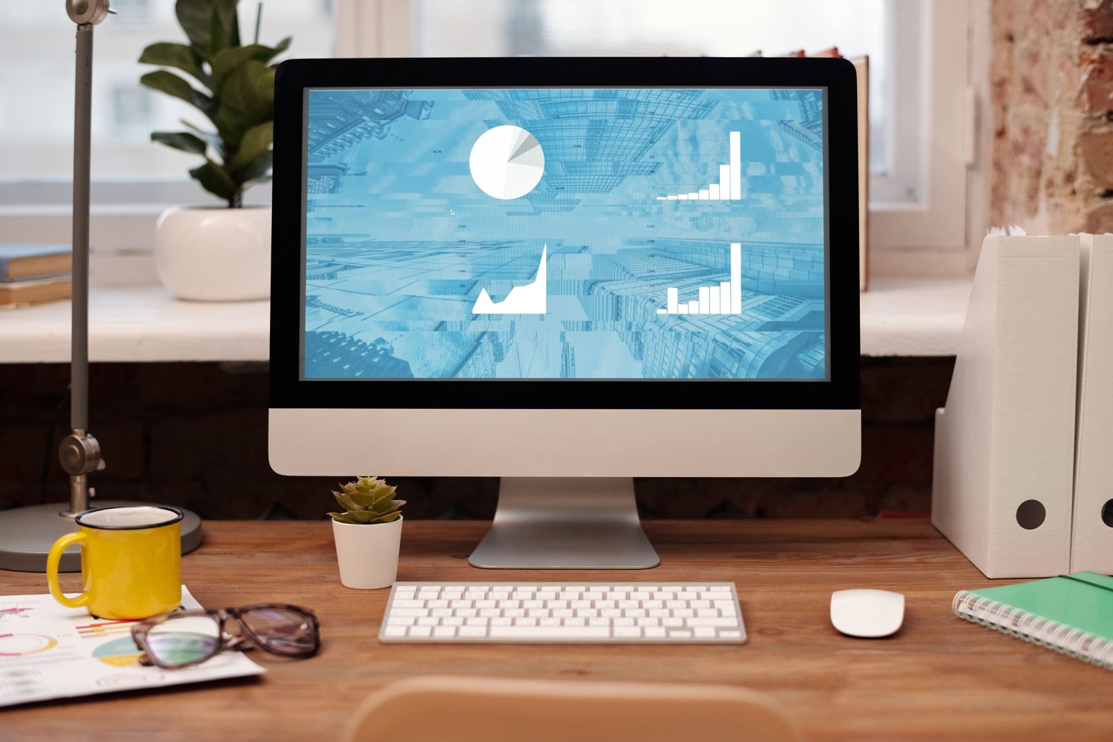 Simple home workspace with plant and natural light, photo credit Mikael Blomkvist via Pexels